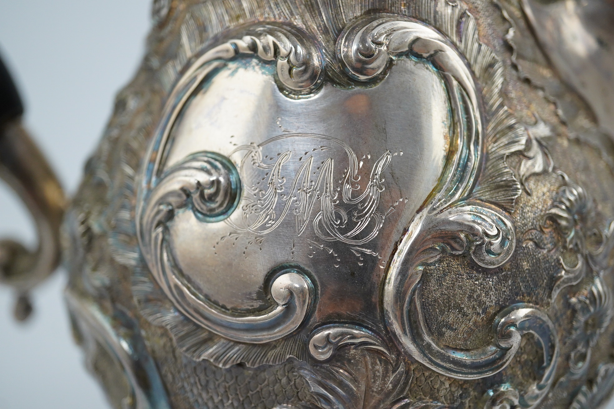 A George III silver coffee pot, by Aldridge & Green, with later embossed decoration